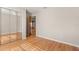 Bedroom with a mirrored closet door and a doorway to another room at 1415 Hensley Dr, Deland, FL 32724