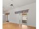 Living room with hardwood floors and sliding glass doors with vertical blinds at 1415 Hensley Dr, Deland, FL 32724