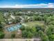 An aerial view showcasing the community's pool, pickleball, basketball, and recreational fields at 148 Tarrytown Trl, Longwood, FL 32750