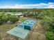 An aerial view of the community's basketball and pickleball courts, near green landscaping at 148 Tarrytown Trl, Longwood, FL 32750