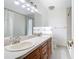 Bathroom featuring double sinks, vanity, and shower with curtain for a functional space at 148 Tarrytown Trl, Longwood, FL 32750