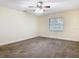 Empty bedroom featuring neutral walls, carpet flooring, a window, and ceiling fan at 148 Tarrytown Trl, Longwood, FL 32750