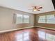 Bedroom with hardwood floors and multiple windows providing plenty of light at 148 Tarrytown Trl, Longwood, FL 32750