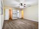 Bright bedroom with a ceiling fan, closet, carpet flooring, and built in shelves at 148 Tarrytown Trl, Longwood, FL 32750