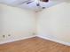 Bedroom with wood-look flooring, ceiling fan, and neutral paint for versatile use at 148 Tarrytown Trl, Longwood, FL 32750