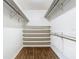 Spacious closet with shelving and hanging rods, providing ample storage solutions at 148 Tarrytown Trl, Longwood, FL 32750