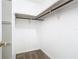Walk-in closet with white walls, carpet flooring, and shelving with a hanging rod at 148 Tarrytown Trl, Longwood, FL 32750