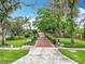 Entrance to a private park with brick walkway, mature trees, landscaping and a 'Private Park' sign at 148 Tarrytown Trl, Longwood, FL 32750