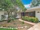 Charming single-story home with a brick accent, lush landscaping, and a curved walkway at 148 Tarrytown Trl, Longwood, FL 32750