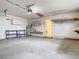 The garage has an automatic door opener, shelves and ample room for storage at 148 Tarrytown Trl, Longwood, FL 32750