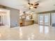 Spacious living room featuring tile flooring and an open layout with a view of the kitchen at 148 Tarrytown Trl, Longwood, FL 32750
