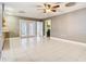 Bright, open living space with tile flooring and French doors leading to the outdoor area at 148 Tarrytown Trl, Longwood, FL 32750
