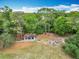An aerial view of the community pavilion and outdoor firepit nestled amongst the trees at 148 Tarrytown Trl, Longwood, FL 32750