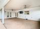Enclosed patio features white brick walls, ceiling fans, TV, and exterior access at 148 Tarrytown Trl, Longwood, FL 32750