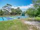 A view of the community's blue and green pickleball courts, with a playground and swing-set nearby at 148 Tarrytown Trl, Longwood, FL 32750