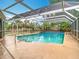 Inviting screened-in pool with clear blue water, offering a refreshing escape in a private backyard setting at 148 Tarrytown Trl, Longwood, FL 32750