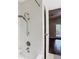 Modern tiled shower with updated fixtures, offering a spa-like experience at 148 Tarrytown Trl, Longwood, FL 32750