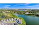 An aerial view of the neighborhood, highlighting the proximity to a beautiful lake and the community layout at 1590 Contentment Loop, Kissimmee, FL 34744