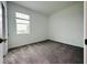 Bright bedroom with neutral carpet and a large window letting in natural light at 1590 Contentment Loop, Kissimmee, FL 34744