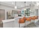 Modern kitchenette with sleek countertops, stainless steel appliances, and stylish pendant lighting at 1590 Contentment Loop, Kissimmee, FL 34744
