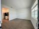 This living room has wood look tile floors and views of the kitchen at 1590 Contentment Loop, Kissimmee, FL 34744