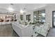 Stylish lounge area with comfortable seating, modern decor, and view of the community pool and surrounding area at 1590 Contentment Loop, Kissimmee, FL 34744