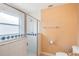 Bathroom with a shower, tiled walls, and updated fixtures at 1621 Sunny St, Kissimmee, FL 34741