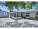 Back exterior view of the home, showing screened-in patio and detached garage at 1621 Sunny St, Kissimmee, FL 34741