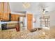 Well-lit kitchen with granite countertops, stainless steel appliances, and ample cabinet space at 1621 Sunny St, Kissimmee, FL 34741
