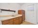Kitchenette featuring cabinets and a stainless steel sink, with a small window for natural light at 1621 Sunny St, Kissimmee, FL 34741