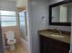 Bathroom with shower-tub combo, a large mirror, and a granite-topped vanity at 1695 E Horatio Ave, Maitland, FL 32751