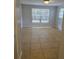 Bedroom with tile floors, neutral walls, and bright windows providing ample natural light at 1695 E Horatio Ave, Maitland, FL 32751