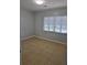 This bedroom has tile floors and a window at 1695 E Horatio Ave, Maitland, FL 32751