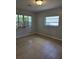 A simple bedroom with tile floors and neutral paint colors at 1695 E Horatio Ave, Maitland, FL 32751