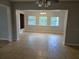 Open-concept dining room with tile flooring, neutral walls, and built in shelving at 1695 E Horatio Ave, Maitland, FL 32751