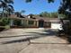 Charming home with inviting blue door and manicured front yard, showcasing curb appeal at 1695 E Horatio Ave, Maitland, FL 32751