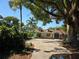 Charming home featuring a unique front door, well-kept yard, and mature trees at 1695 E Horatio Ave, Maitland, FL 32751
