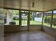This porch features tile floors and views of the backyard at 1695 E Horatio Ave, Maitland, FL 32751