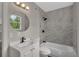 Newly remodeled bathroom with modern fixtures, marble-look tile, and a bathtub at 1840 Lillian Dr, St Cloud, FL 34771