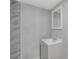 Bathroom featuring marble tiling, a modern sink, and a vanity at 1840 Lillian Dr, St Cloud, FL 34771
