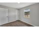 Bright bedroom featuring a closet, window and new flooring at 1840 Lillian Dr, St Cloud, FL 34771