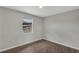 Cozy bedroom with new flooring and a large window for ample natural light at 1840 Lillian Dr, St Cloud, FL 34771