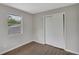 Bedroom features new flooring, ample natural light, and a large closet at 1840 Lillian Dr, St Cloud, FL 34771