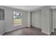 Bright bedroom with a window, closet, and wood-look flooring at 1840 Lillian Dr, St Cloud, FL 34771
