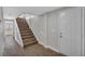 Entryway with a white front door, staircase, and wood-look flooring at 1840 Lillian Dr, St Cloud, FL 34771