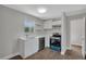 Bright kitchen features white cabinets, quartz counters, and stainless appliances at 1840 Lillian Dr, St Cloud, FL 34771
