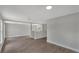 Open concept living area with wood-look floors, neutral paint, and bright natural light at 1840 Lillian Dr, St Cloud, FL 34771