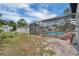 The screened pool is surrounded by a wood deck at 1840 Lillian Dr, St Cloud, FL 34771