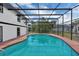 A screened-in pool is conveniently located next to the house and allows for enjoyment without insects at 1840 Lillian Dr, St Cloud, FL 34771