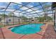 A screened-in pool has a red deck and provides a comfortable area for relaxation and recreation at 1840 Lillian Dr, St Cloud, FL 34771